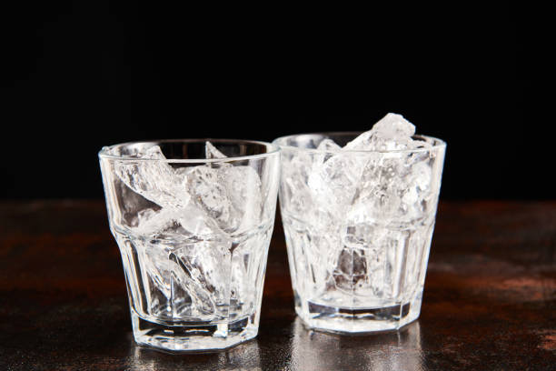 istock glass with frosted ice cubes isolated on black 1190170689