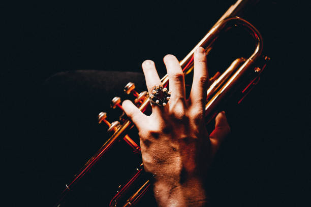 The hands of the trumpet player Trumpet, Player, vintage, dark, art, jazz, trumpet player, hand, luxury, jewelry, classical concert photos stock pictures, royalty-free photos & images