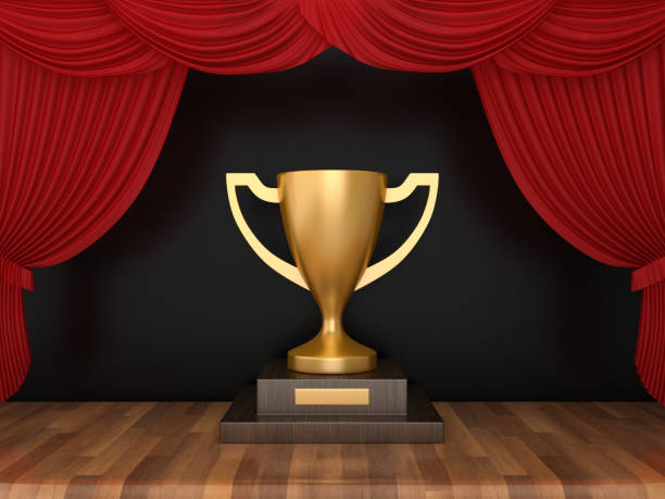 istock Trophy with Red Stage Curtains on Wood Floor - 3D Rendering 1190175461