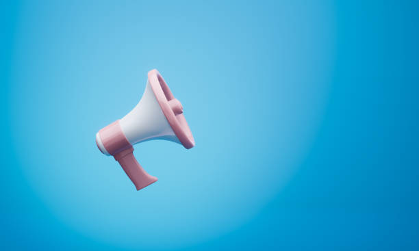 istock 3d rendering of a pink and white megaphone hangs on a blue background 1190175524