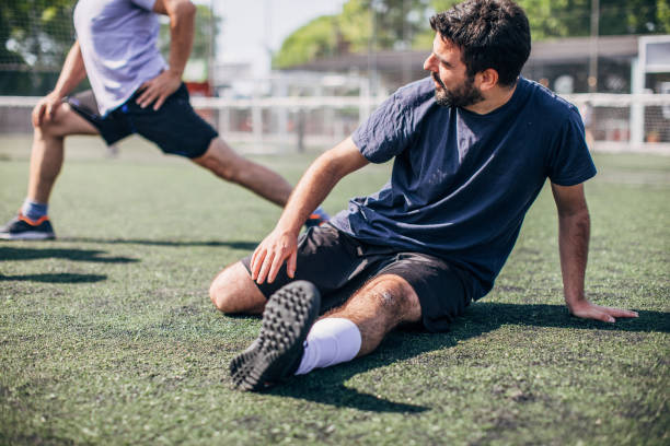 istock Man warming up for soccer match 1190176841