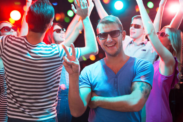istock Young man posing in the night club 1190178547