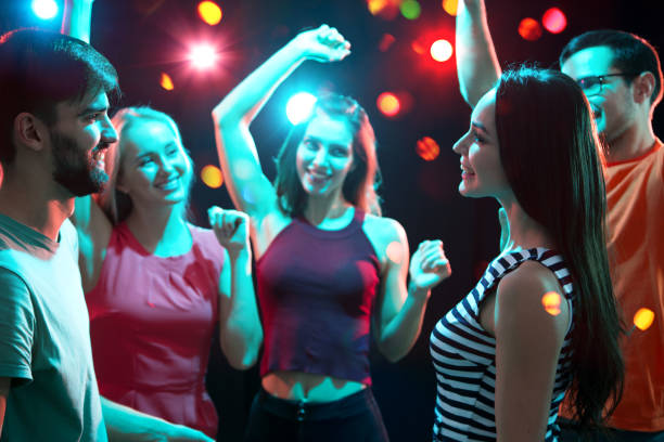istock Group of young people having fun dancing at party. 1190179851