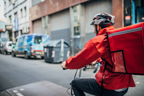 istock Food delivery man on bicycle 1190180867