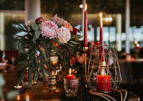 istock Beautiful, decorated table with flower decorations and red candles. Christmas evening or wedding party decoration. 1190180965