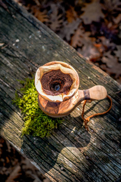 istock Ready to dropping water on the ground coffee. coffee break with drip coffee on the forest, ground coffee on the filter paper and wood dripper 1190180991
