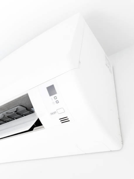 istock Modern air condition unit on a white wall inside the living room. 1190181144