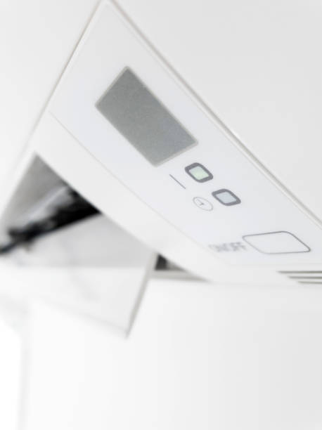 istock Modern air condition unit on a white wall inside the living room. 1190181178