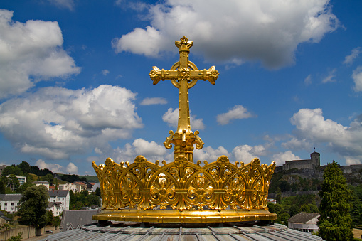 Golden crown on Basilica of the Immaculate Conception in Lourdes, France