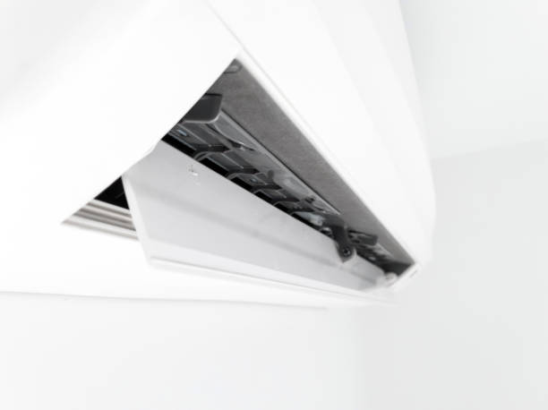 istock Modern air condition unit on a white wall inside the living room. 1190181186