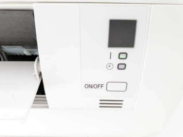 istock Modern air condition unit on a white wall inside the living room. 1190181315