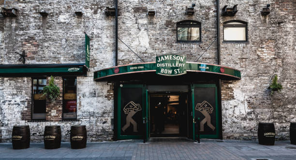 architectural detail of the old irish whiskey distillery of the commercial brand jameson - liffey river imagens e fotografias de stock