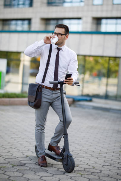 istock Businessman riding electric scooter and text messaging 1190183284
