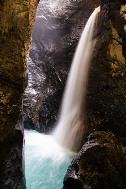 istock trummelbach falls, the biggest waterfall in Europe, inside a mountain accessible for public, Lauterbrunnen village, canton Bern, Switzerland 1190183433