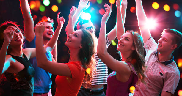 istock Group of young people having fun dancing at party. 1190183523