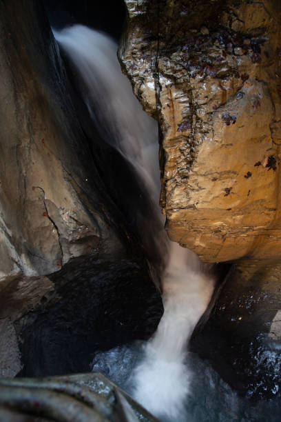 istock trummelbach falls, the biggest waterfall in Europe, inside a mountain accessible for public, Lauterbrunnen village, canton Bern, Switzerland 1190183642