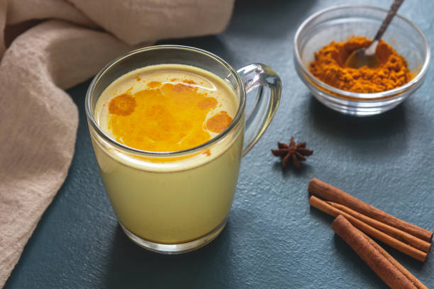 istock Golden milk with turmeric on a blue background 1190185204