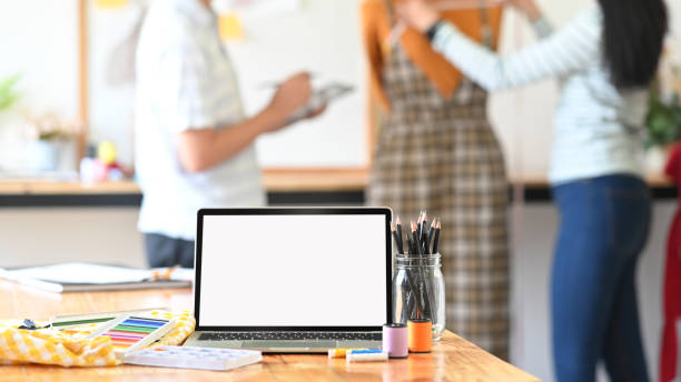 istock Laptop computer with blank screen on fashion designer Tailor workspace. 1190185378