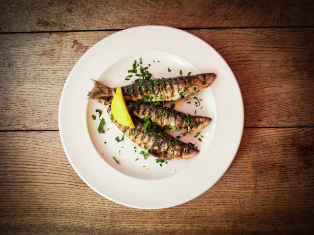 istock Grilled Sardines on white plate 1190187166