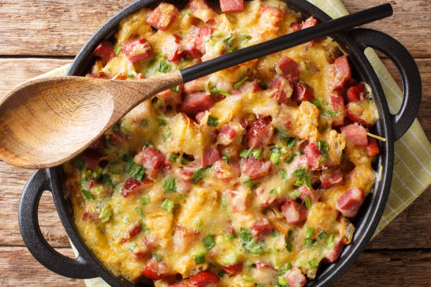 istock recipe for a simple strata with ham, bread, onions, cheese and eggs close-up in a pan. Horizontal top view 1190187235