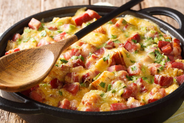 istock recipe for a simple strata with ham, bread, onions, cheese and eggs close-up in a pan. horizontal 1190187413