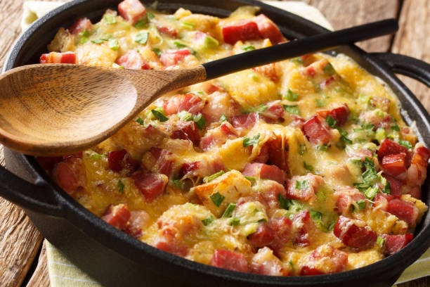 istock Traditional american strata with ham, bread, onions, cheese and eggs close-up. horizontal 1190187473