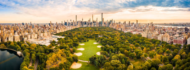 Aerial panorama of New York skyline at sunset Aerial panorama of New York midtown skyline at sunset viewed from above Central Park. central park manhattan stock pictures, royalty-free photos & images
