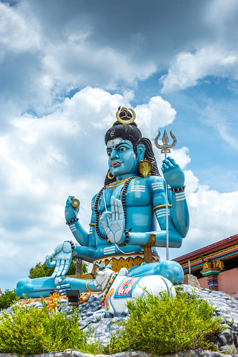 The giant statue of god Shiva Koneshwaram, Trincomalee Sri Lanka. Under a dramatic sky.