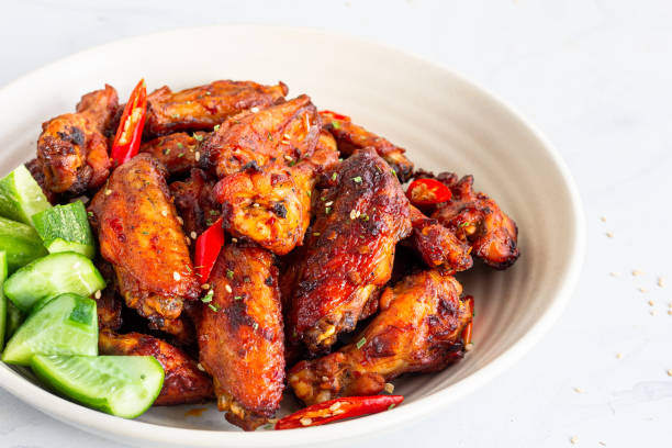 istock Baked Chicken Wings on White Background 1190191141