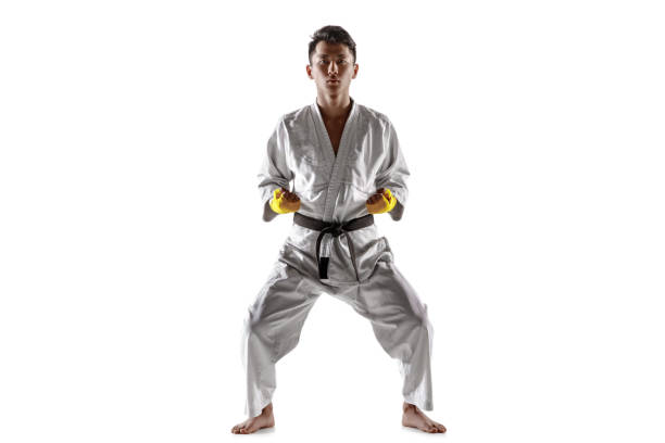 istock Confident korean man in kimono practicing hand-to-hand combat, martial arts 1190191805