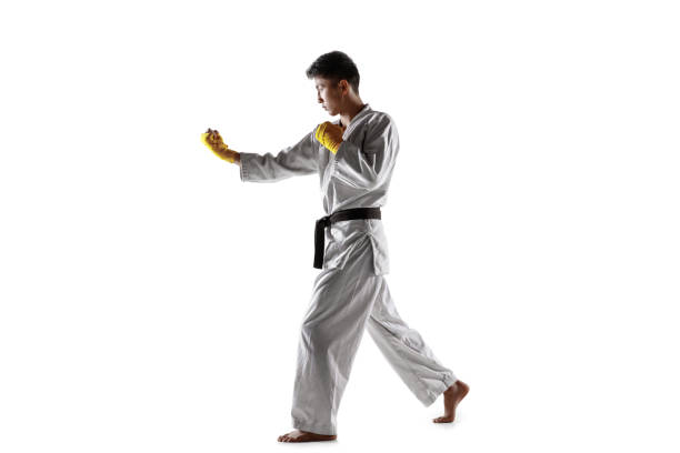 istock Confident korean man in kimono practicing hand-to-hand combat, martial arts 1190191824