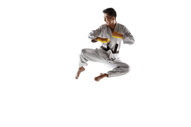 istock Confident korean man in kimono practicing hand-to-hand combat, martial arts 1190191923