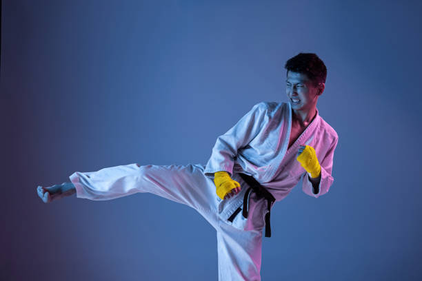 istock Confident korean man in kimono practicing hand-to-hand combat, martial arts 1190192660