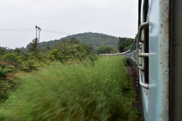istock train crossing meadows in a hilly railroad with a motion blur 1190196355