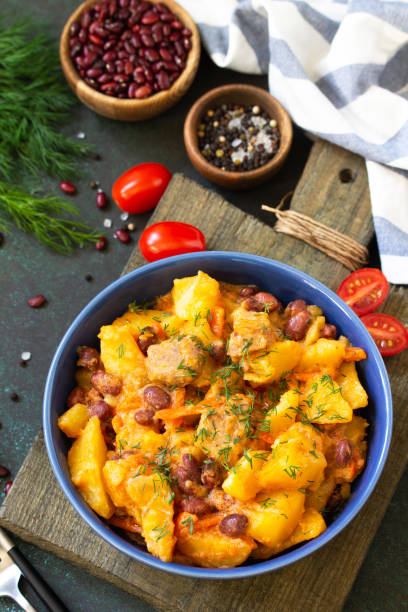 istock Thanksgiving Autumn Menu. Stew with beans and vegetables in a bowl on a rustic table. 1190196360