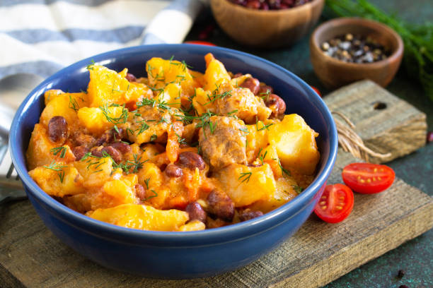 istock Thanksgiving Autumn Menu. Stew with beans and vegetables in a bowl on a rustic table. 1190196370
