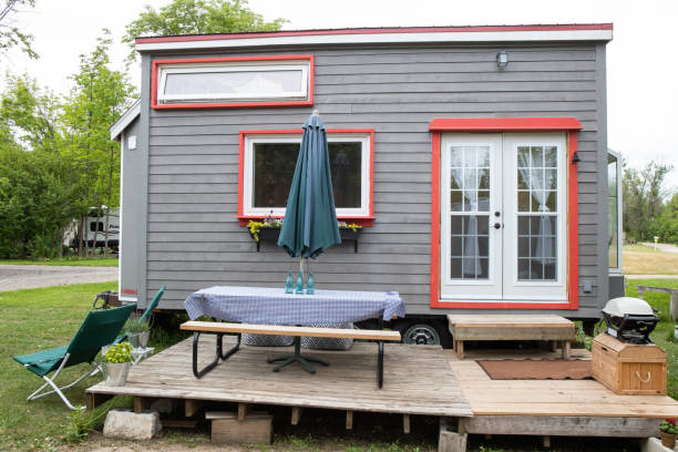 istock Funky girl shows off her DIY Tiny Home 1190197049