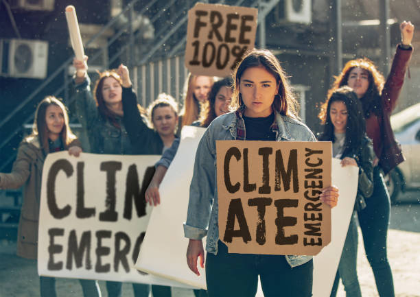 istock Young people protesting of climate emergency on the street 1190197918