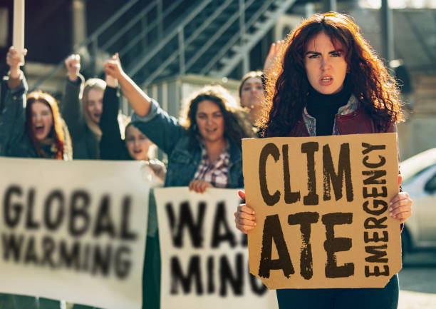 istock Young people protesting of climate emergency on the street 1190197926