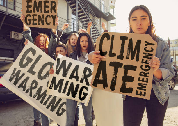 istock Young people protesting of climate emergency on the street 1190197928