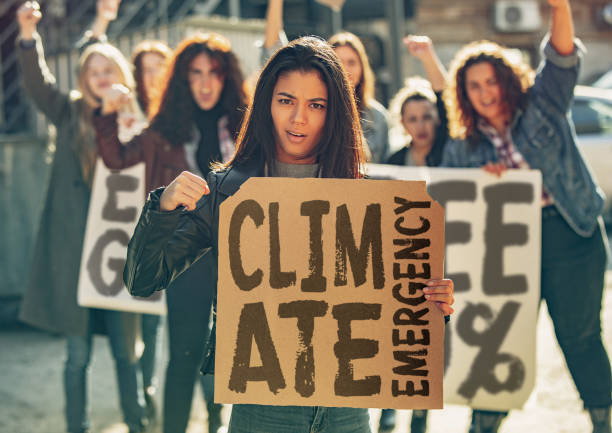 istock Young people protesting of climate emergency on the street 1190197943