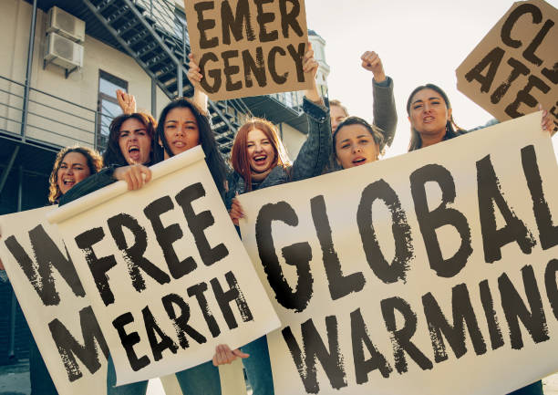 istock Young people protesting of climate emergency on the street 1190197962