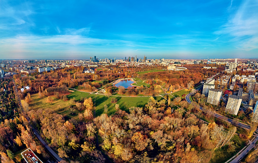 A beautiful panoramic view of the sunset in a fabulous November autumn evening at sunset from drone at Pola Mokotowskie in Warsaw, Poland - Mokotow Field is a large park called \