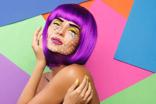 Photo of Model in creative image with pop art makeup