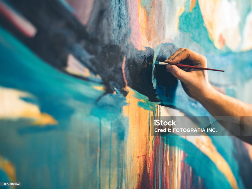 The painter hands Hands of Young painter working on his art inside his studio. Art Stock Photo