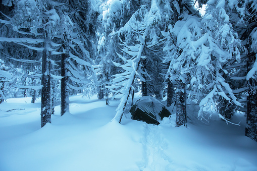 Winter camping in mountains