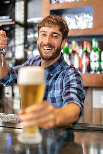 Man serving beer at a pub