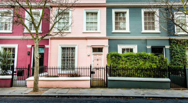 Beautiful Traditional British Terraced Houses Row of Colourful Old Terraced Houses in the London Neighbourhood of Notting Hill notting hill stock pictures, royalty-free photos & images