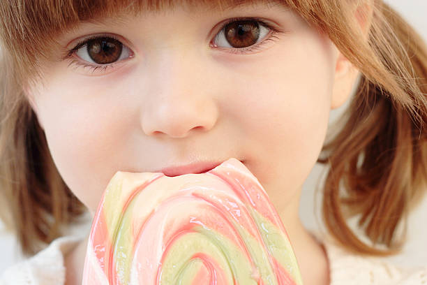 istock Girl and a lollipop 119020107