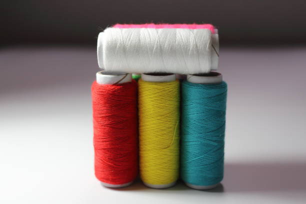 Making traditional scottish tartan textile yarn thread at dundee scotland england UK